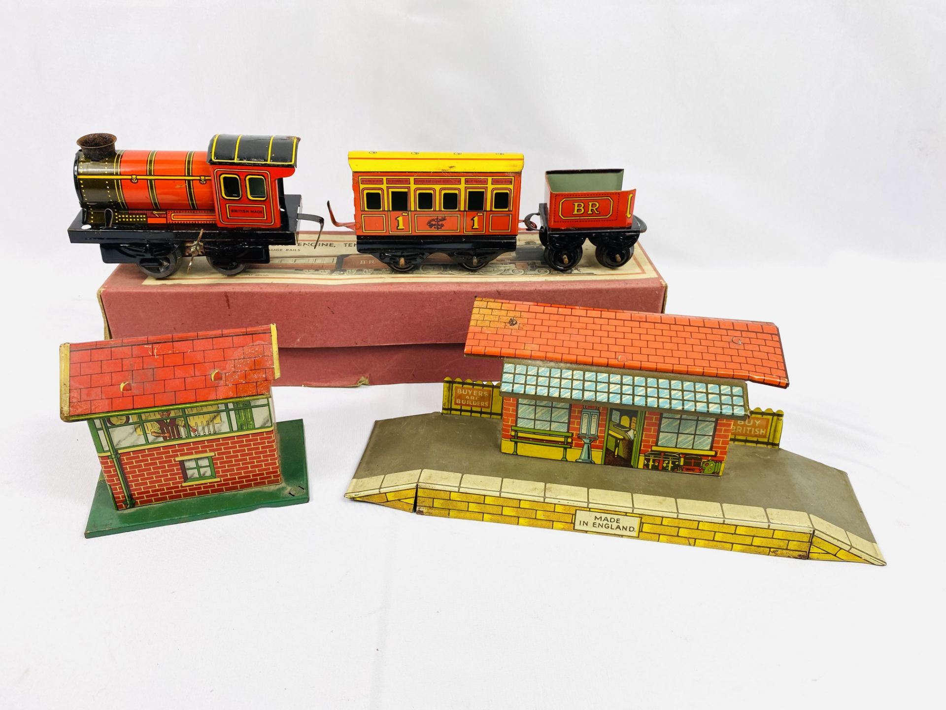 Boxed tinplate O gauge engine, tender and coach