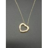 9ct gold chain and heart shaped pendant set with a diamond