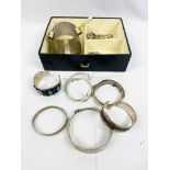 Quantity of silver and white metal bangles and bracelets.