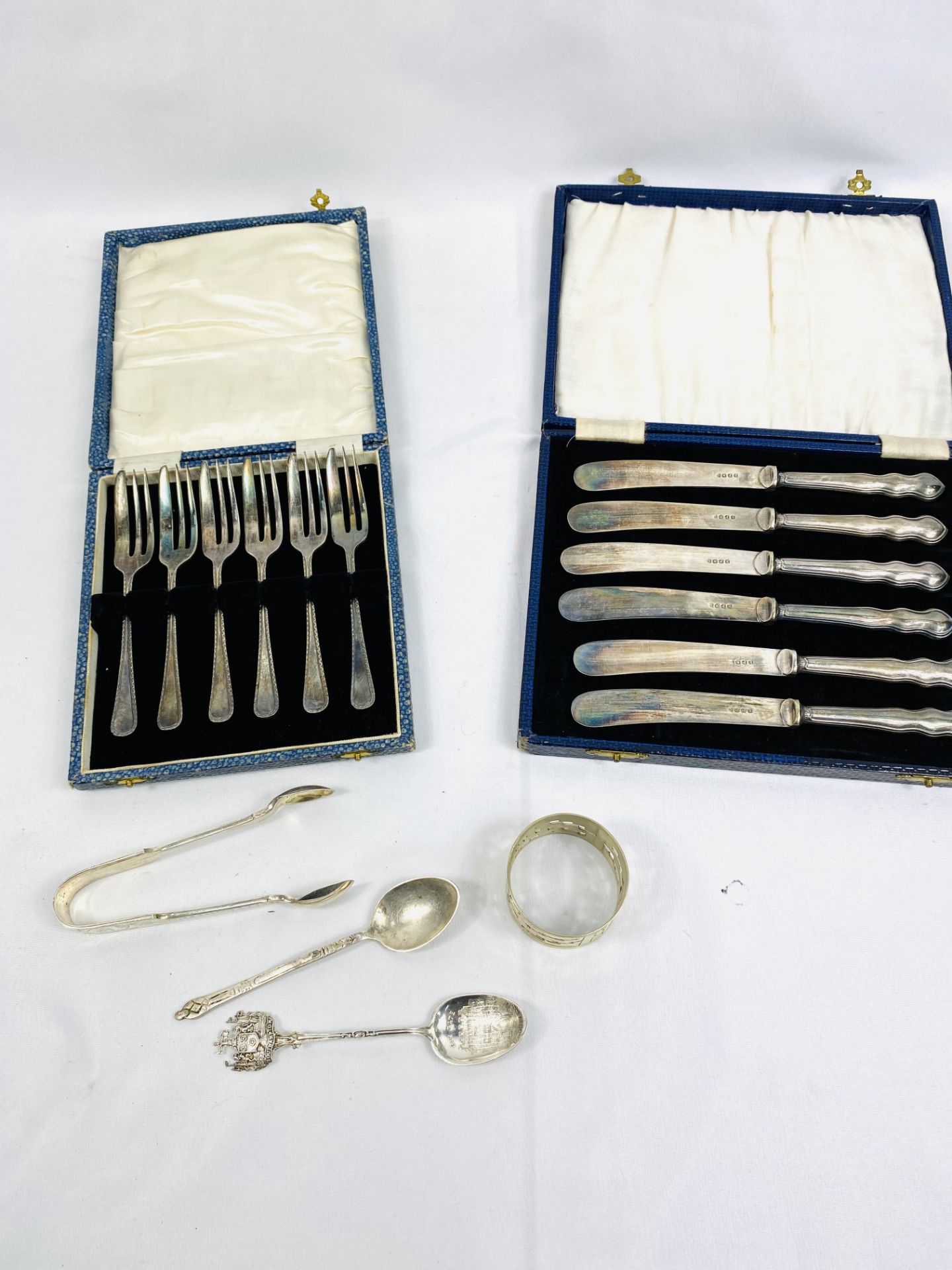 Boxed set of six silver handled knives together with other items