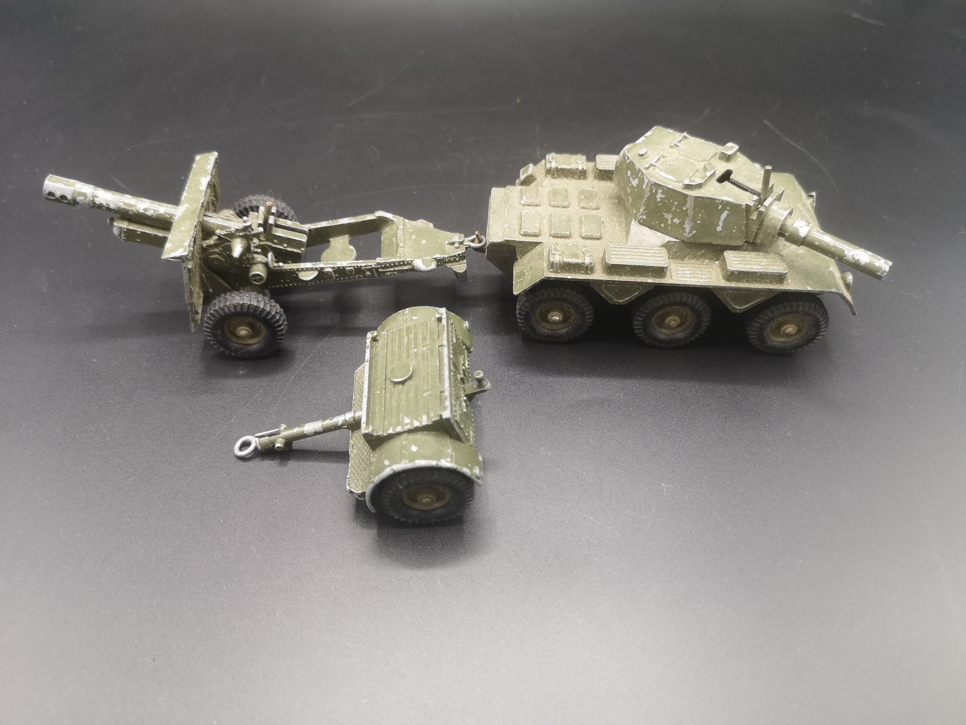 A Crescent diecast model tank together with a Dinky die-cast model missile launcher