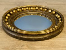 Circular convex mirror in gilt wood frame