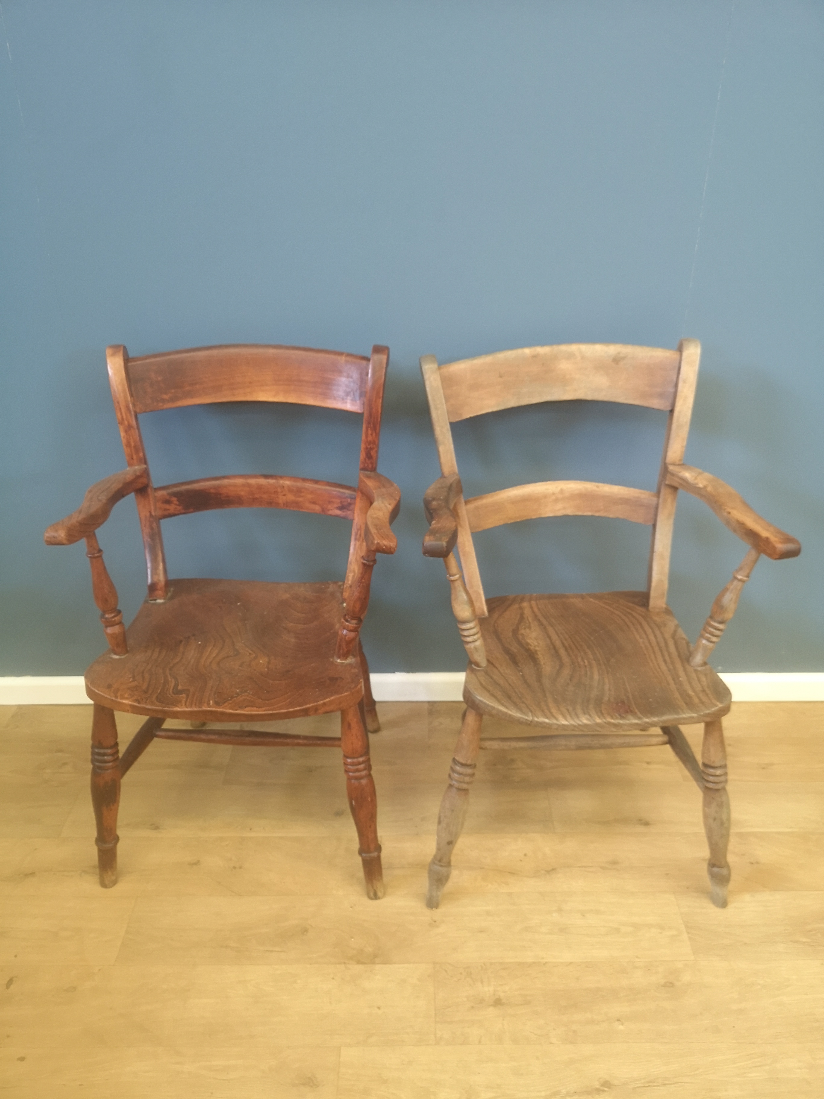 Two open armchairs with elm seats