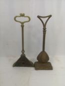 Two Victorian brass door stops