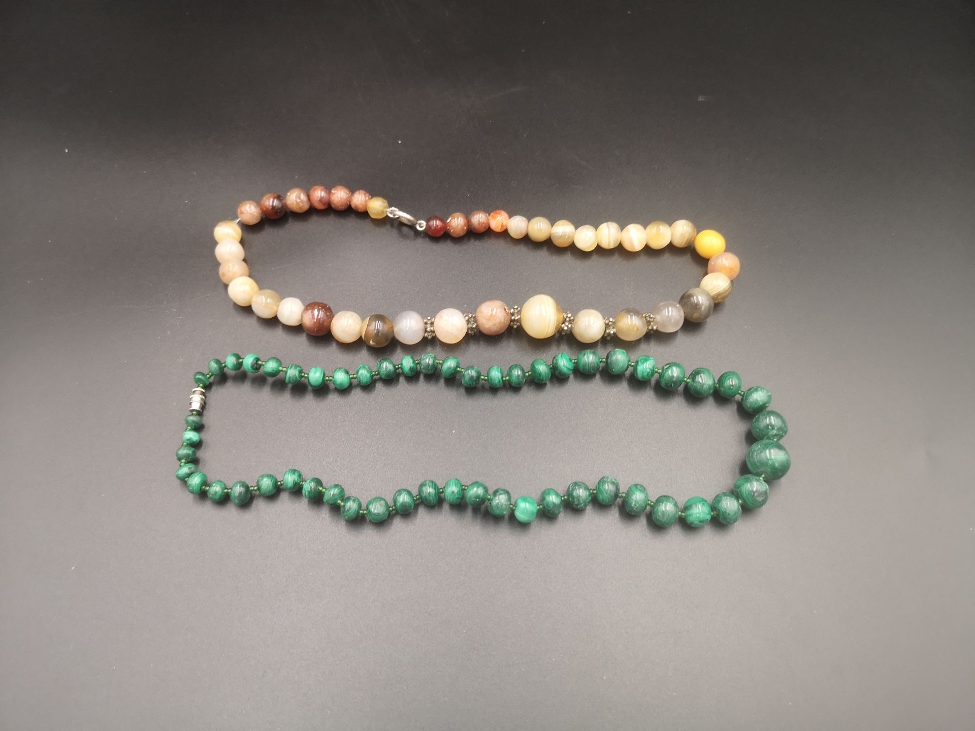 Malachite necklace together with an onyx necklace