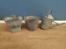 Two galvanised buckets and a watering can
