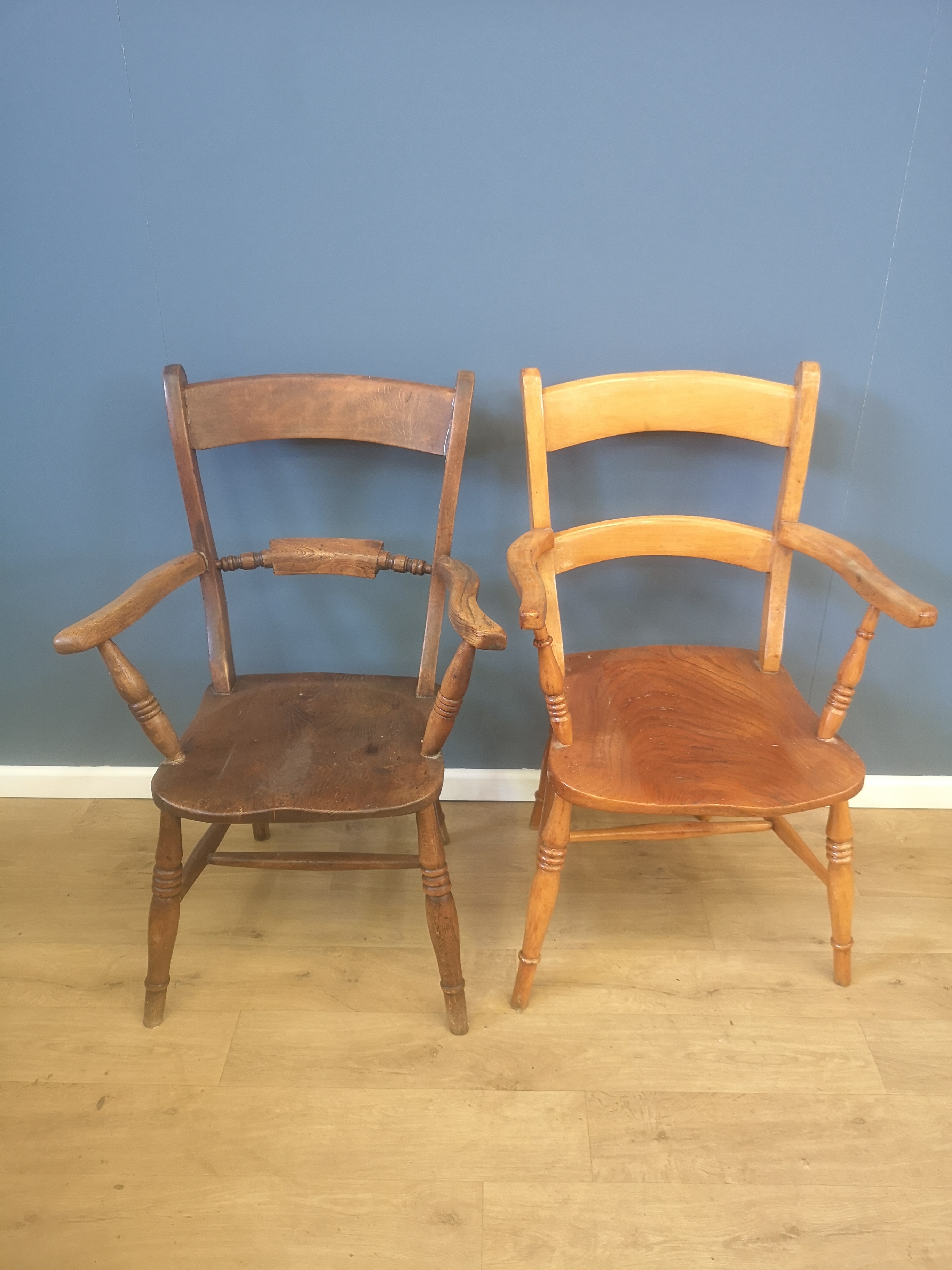 Two open armchairs with elm seats