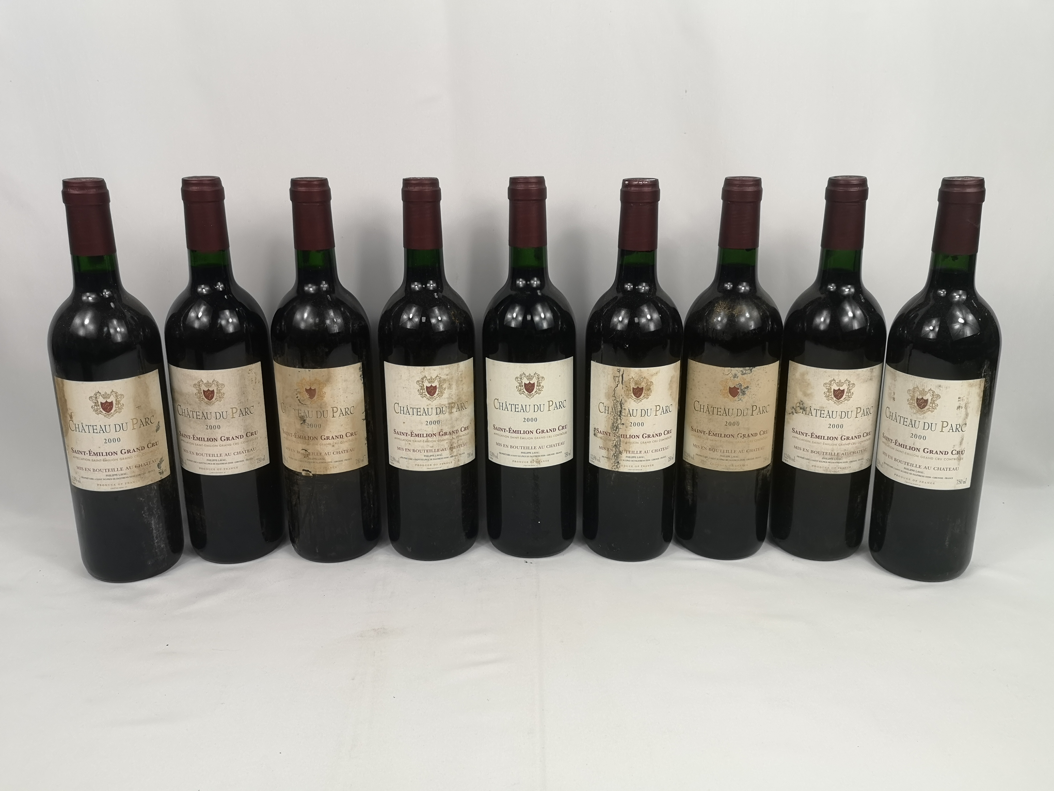 Nine 75cl bottles of Château du Parc Saint-Emilion Grand Cru 2000.