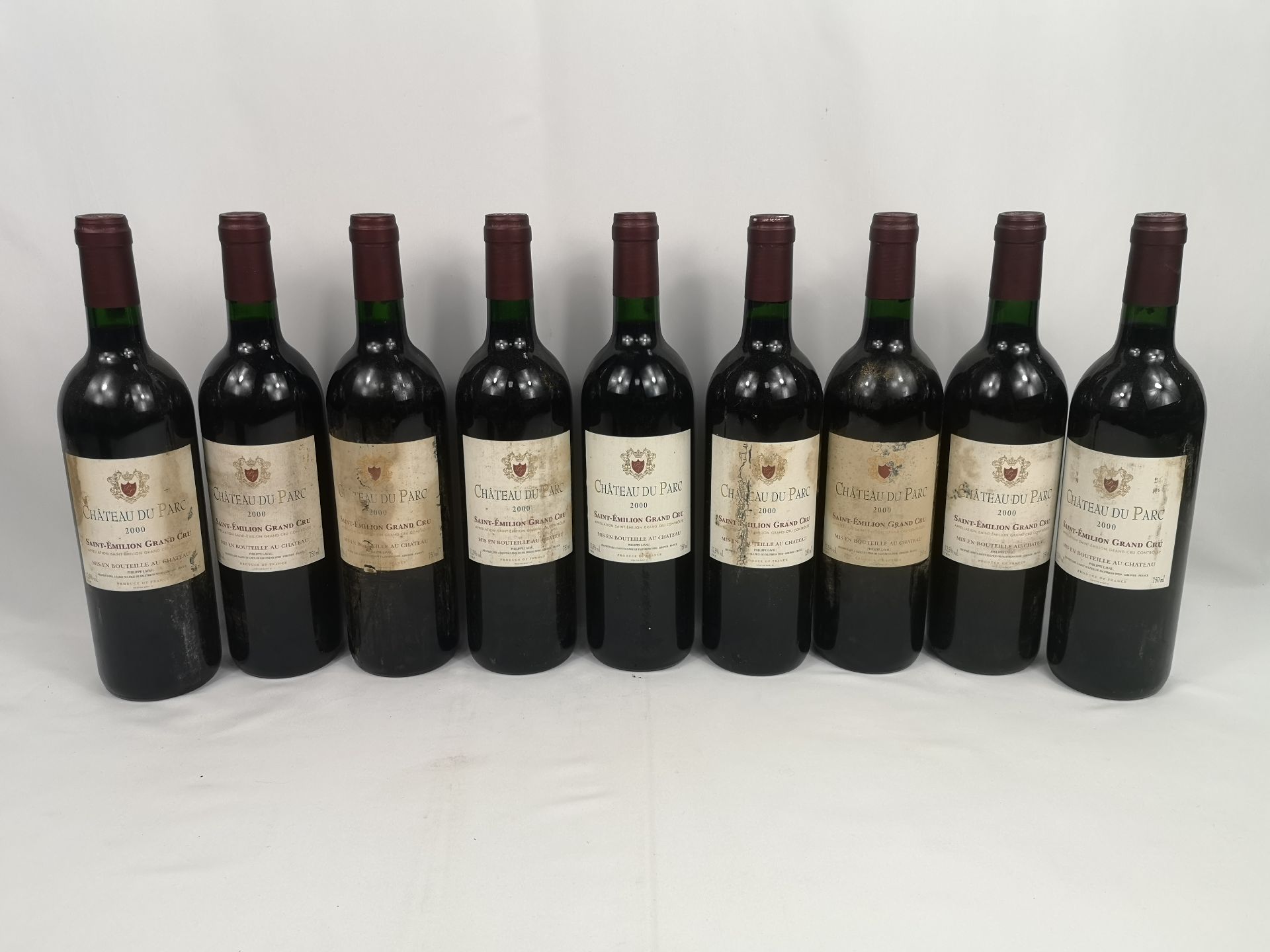 Nine 75cl bottles of Château du Parc Saint-Emilion Grand Cru 2000.