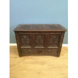 Oak chest with carved flowers to front