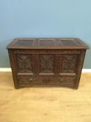 Oak chest with carved flowers to front