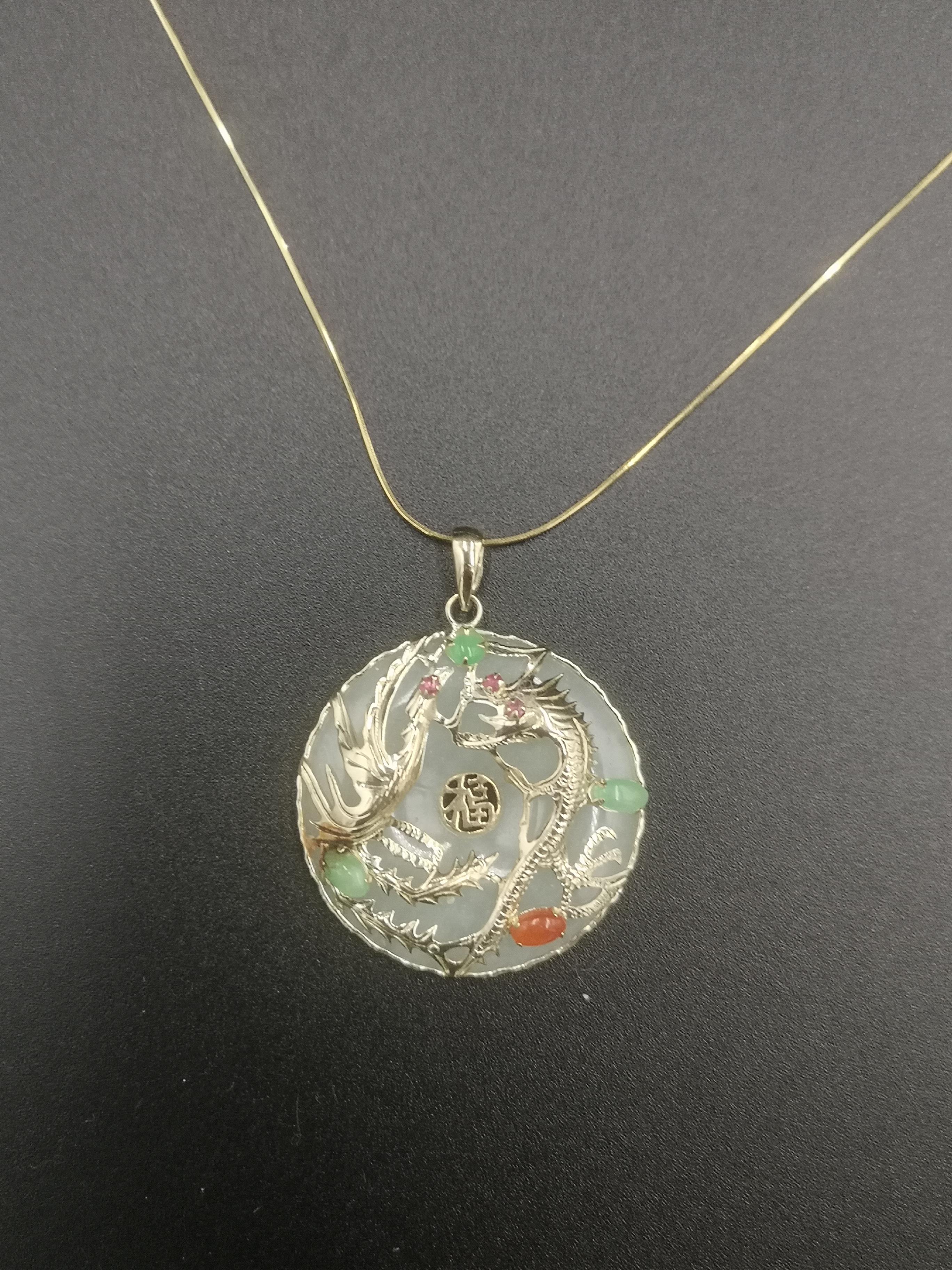 14ct gold and jade pendant