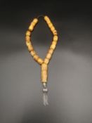 Mosaic amber worry beads