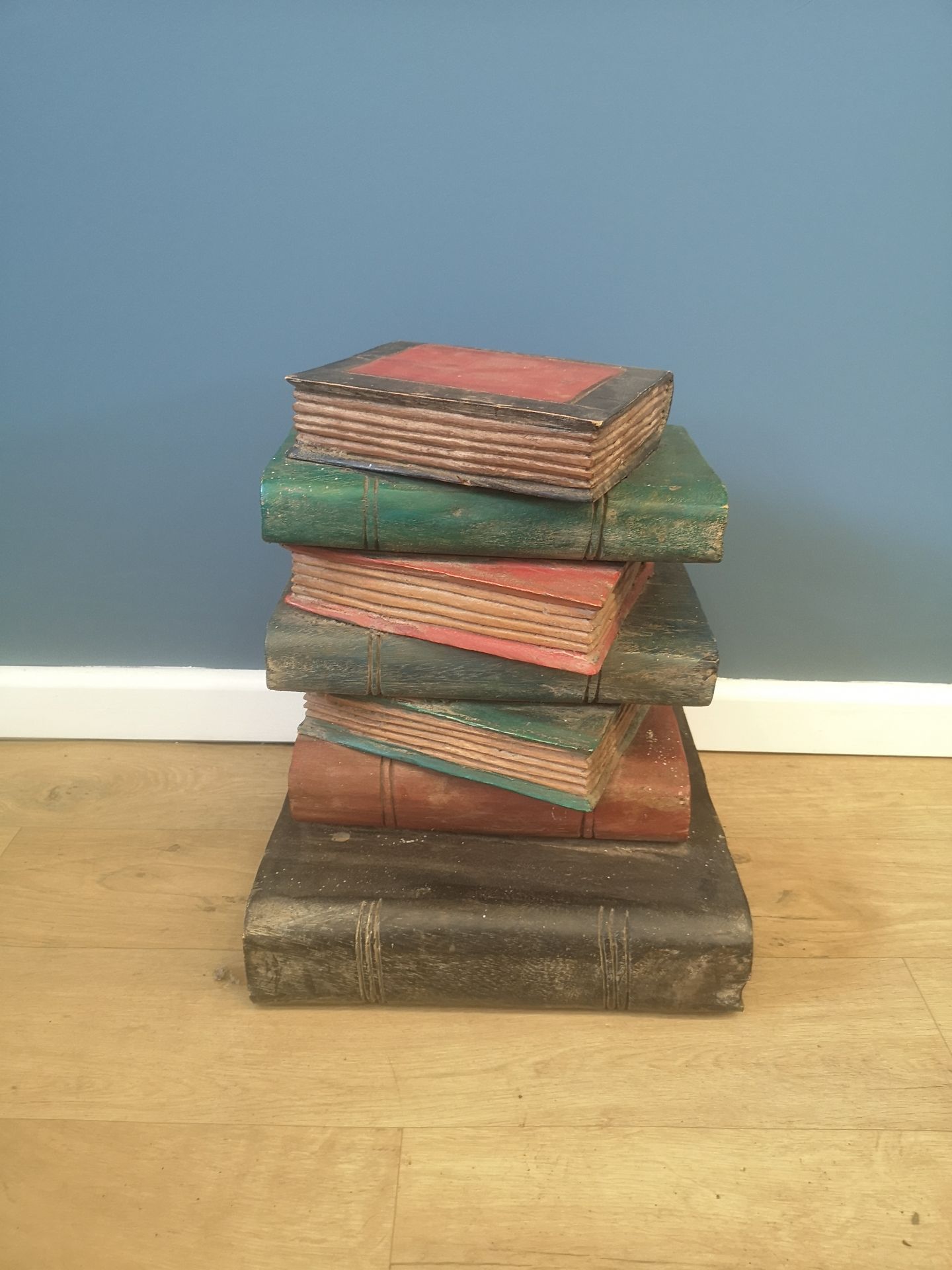 Decorative wood 'pile of books' side table
