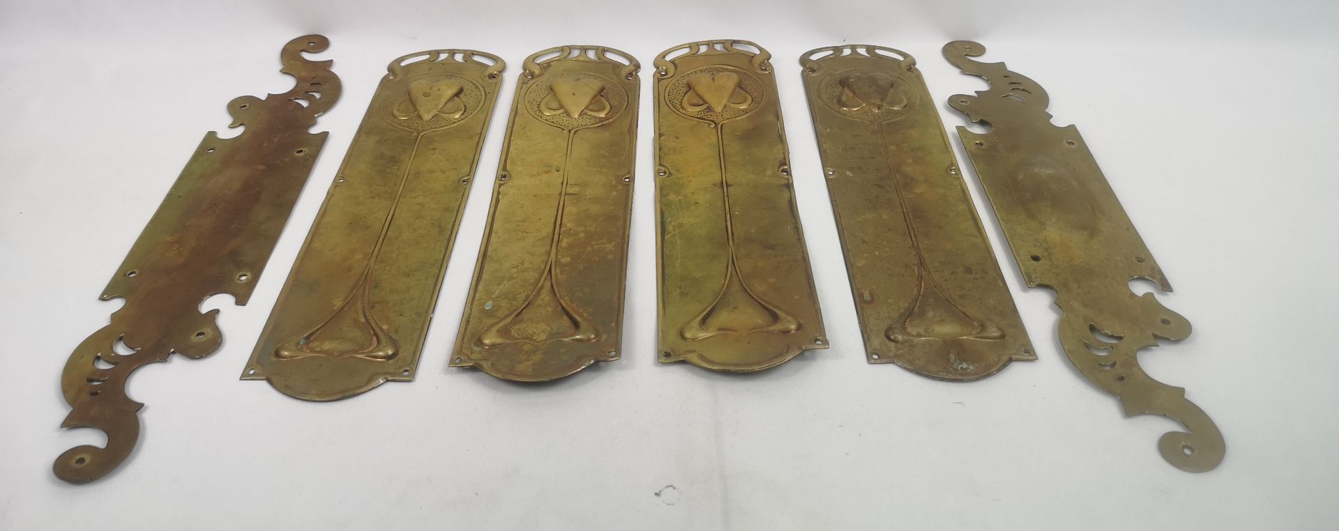 Six art nouveau style brass door plates