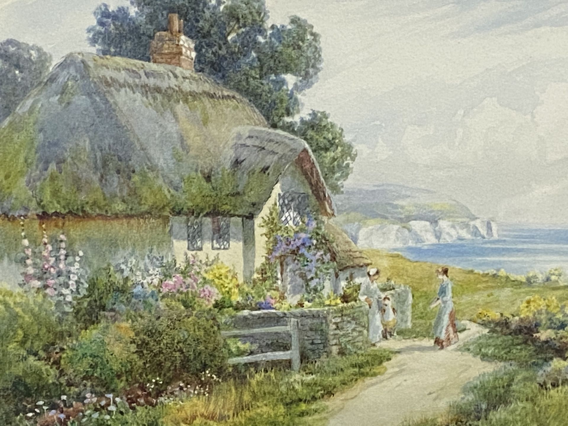 Framed and glazed watercolour of a cottage