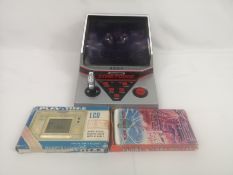 Grandstand Star Force game together with two LCD games