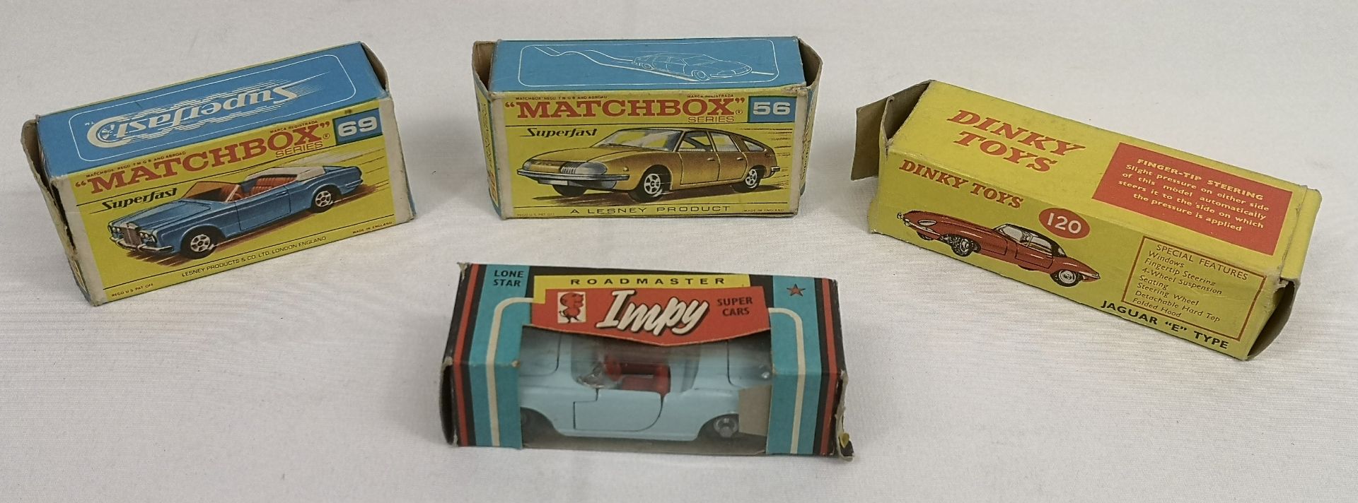Two boxed Matchbox Series cars together with two others