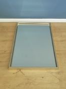 Contemporary wall mirror. This lot is subject to VAT.