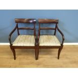Two mahogany open arm chairs