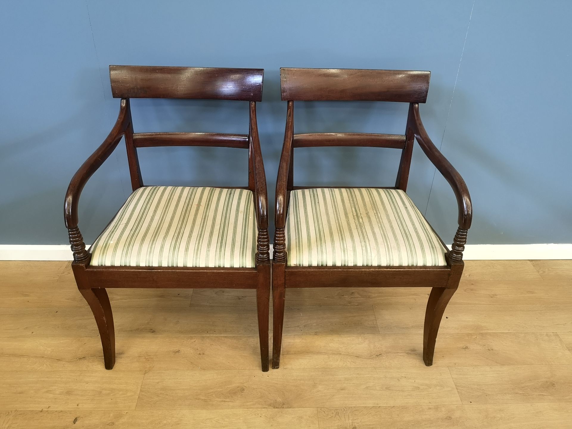 Two mahogany open arm chairs