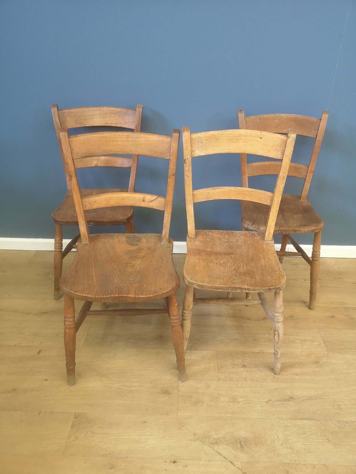 Four unmatched kitchen chairs