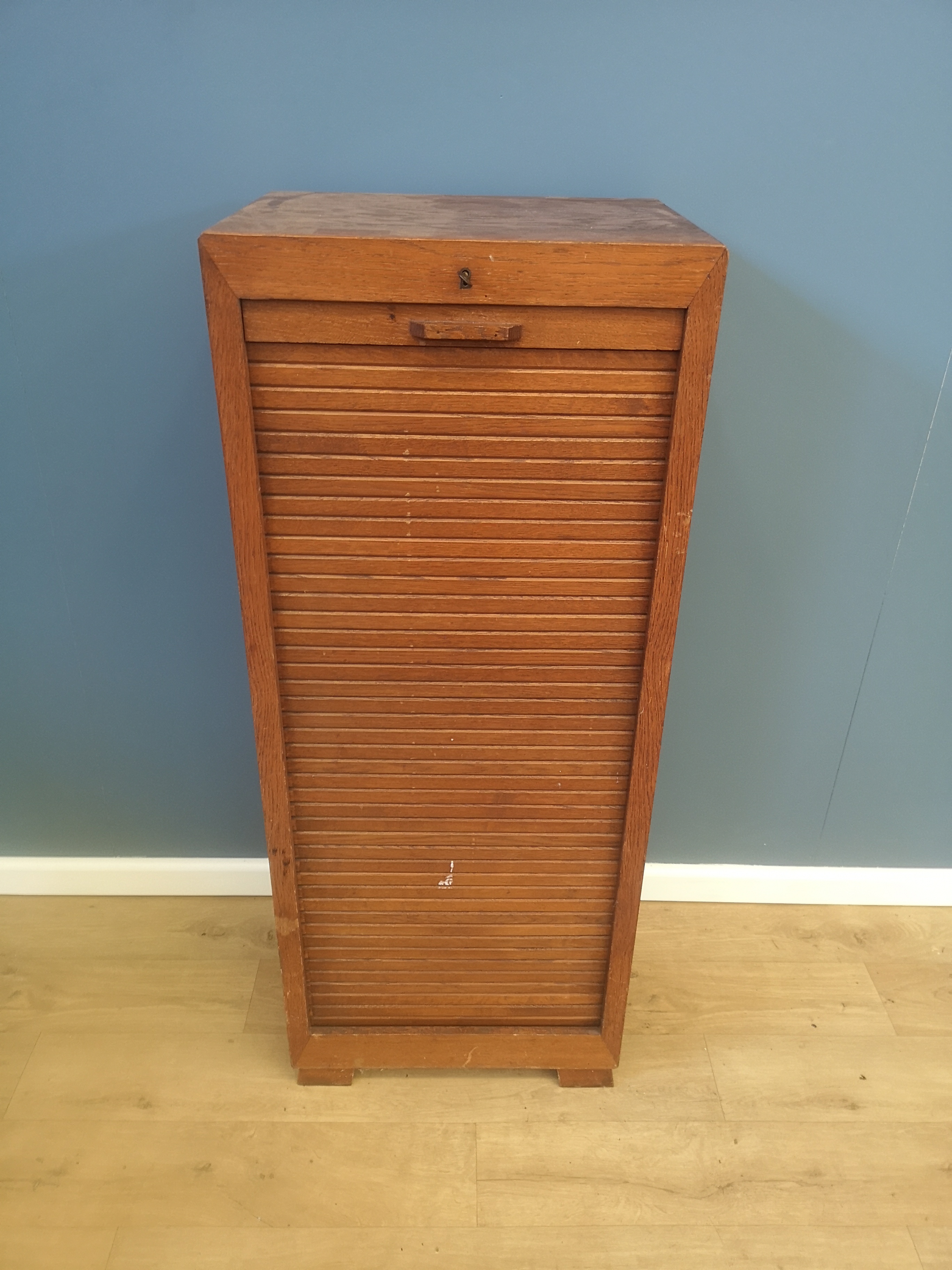 Oak tambour fronted chest of drawers
