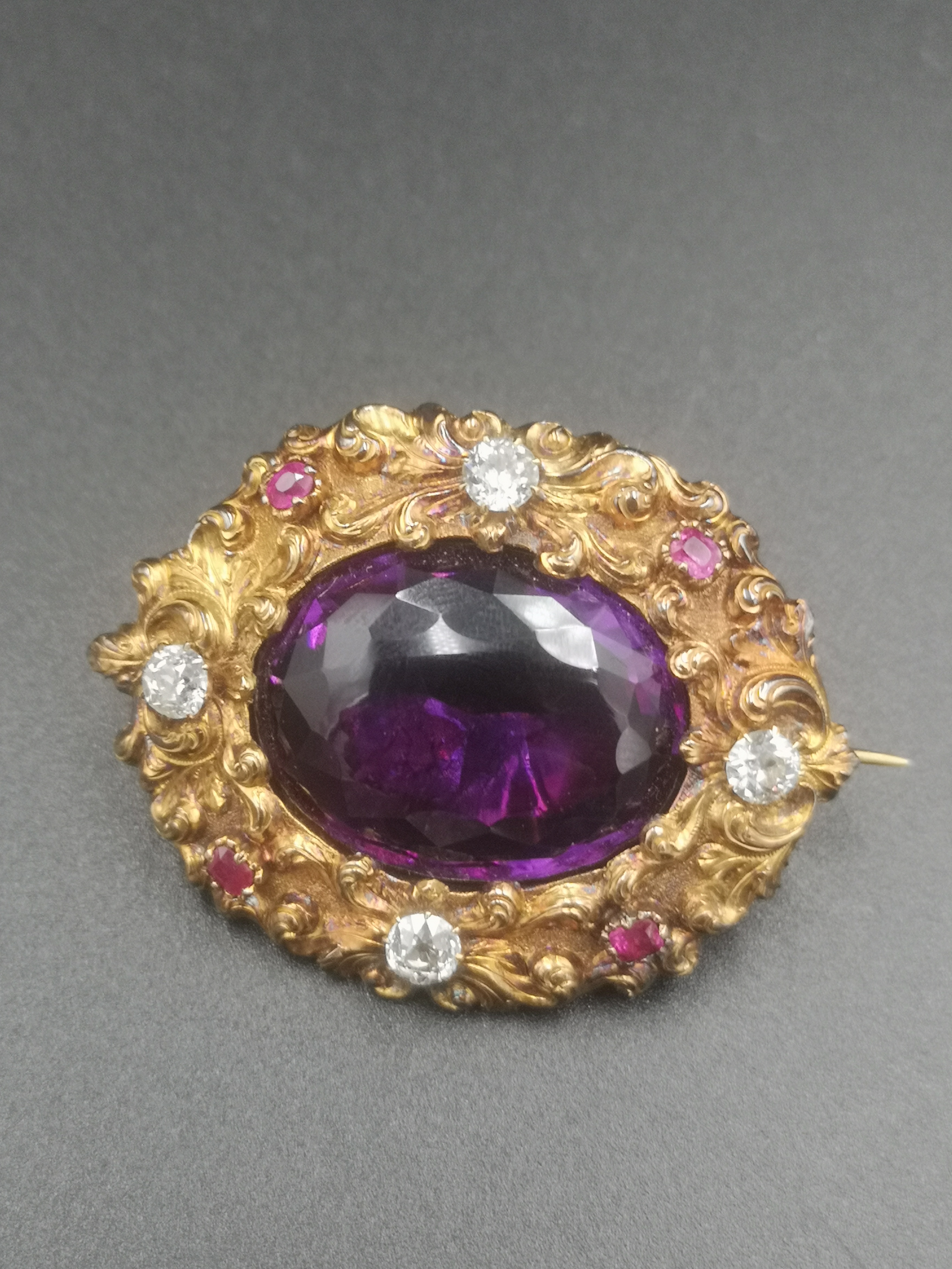 Brooch set with amethyst, diamonds and rubies