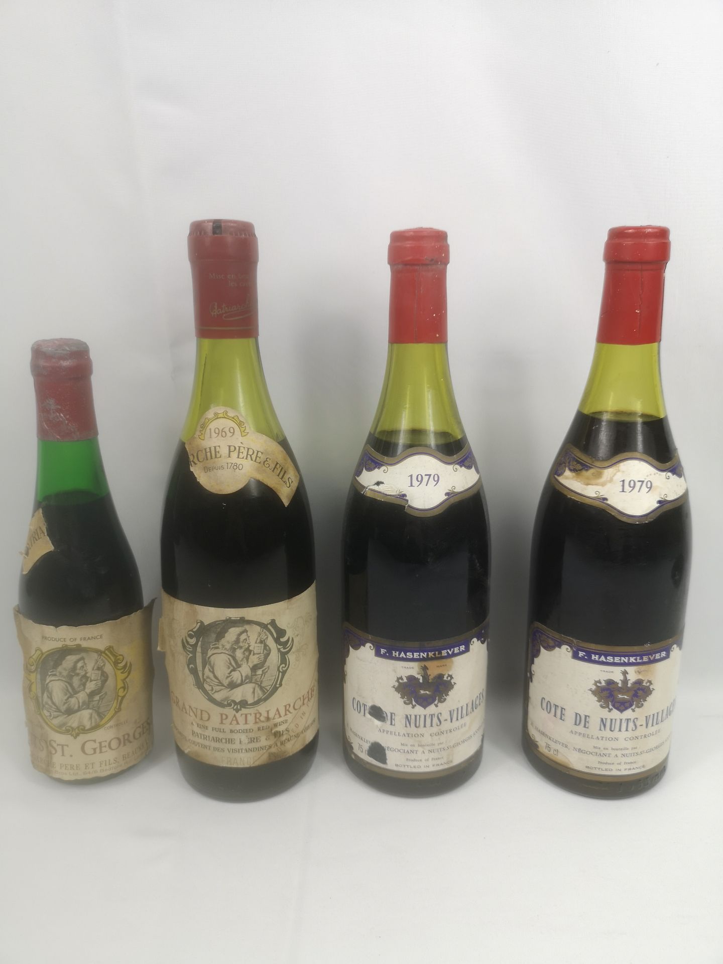 Four bottles of red wine