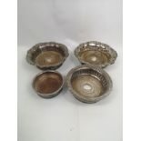 Pair of Sheffield plate bottle coasters together with a silver plate coaster