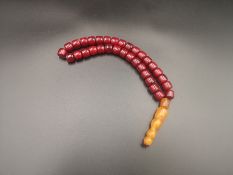 Cherry amber bakelite worry beads