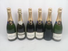 Five 75cl bottles of Monsigny Brut together with a 75cl bottle of Corte Alta Prosecco