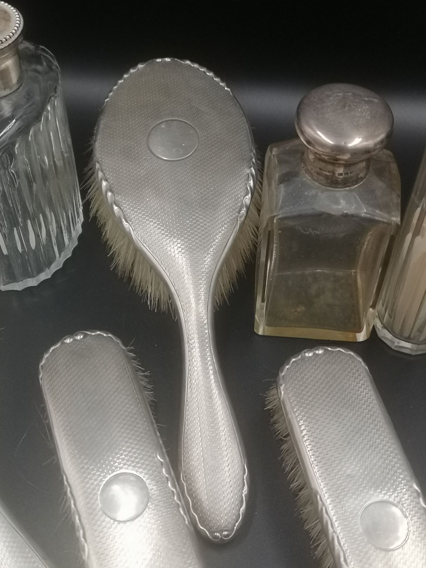 Four silver backed dressing table brushes together with silver topped bottles - Image 6 of 7