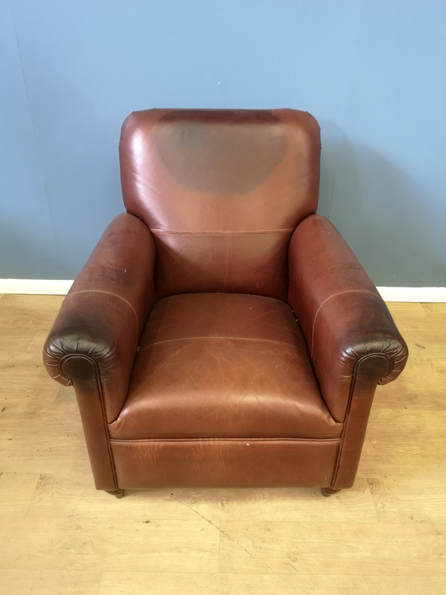 Brown leather style armchair