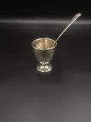 Silver egg cup and spoon