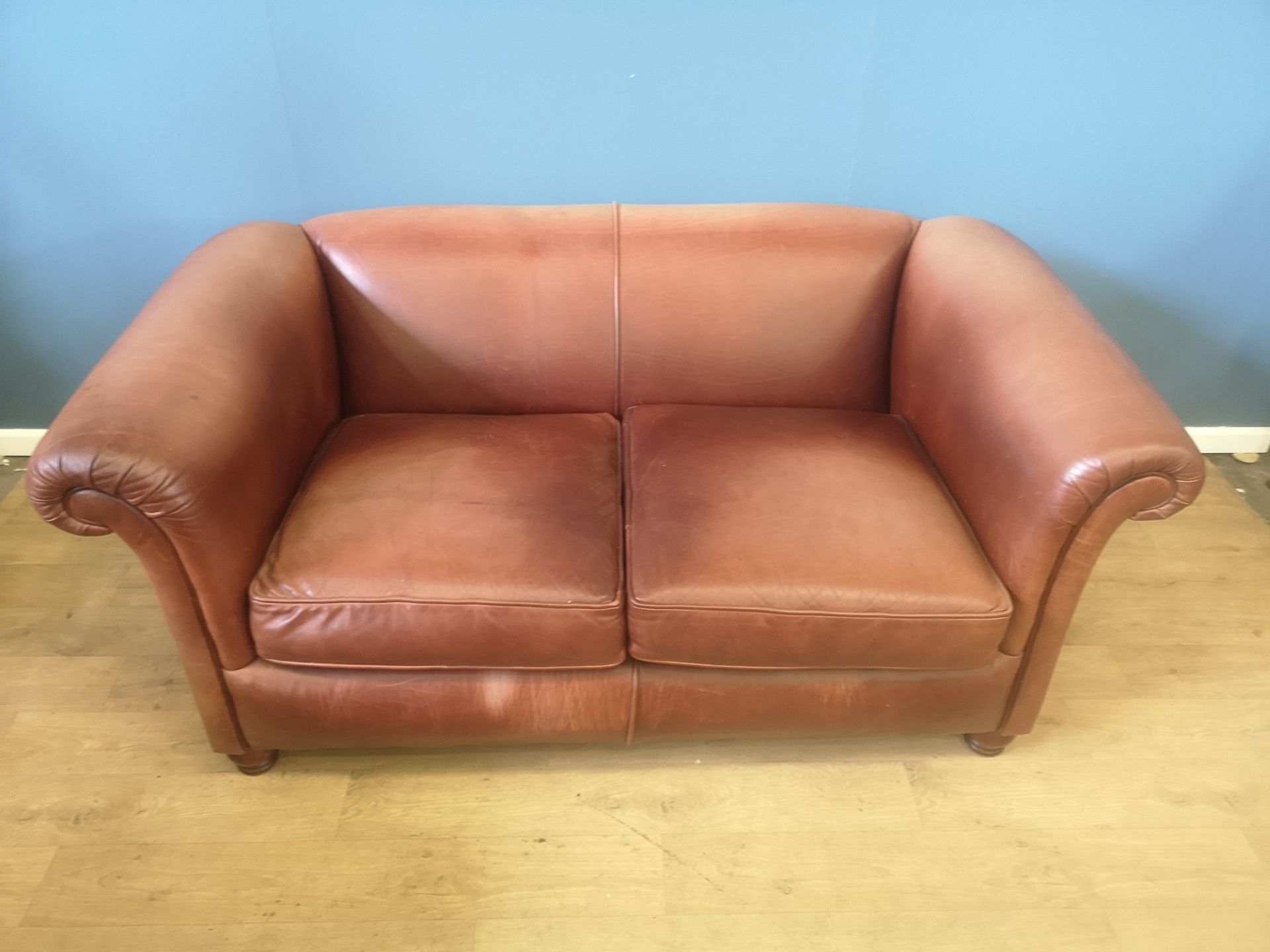 Brown leather two seat sofa