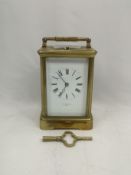 Brass carriage clock written to face T.R. Russell