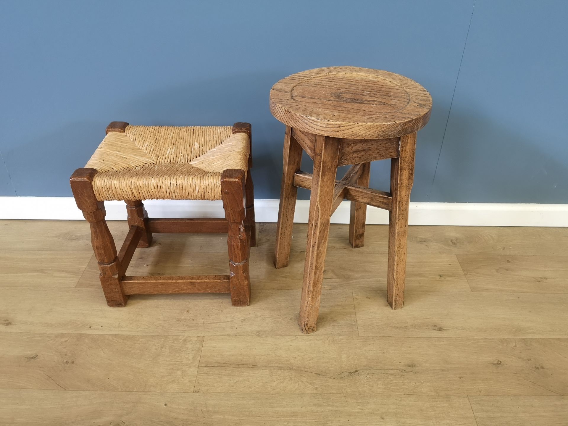 Robert Mouseman oak stool with rush seat, together with another stool