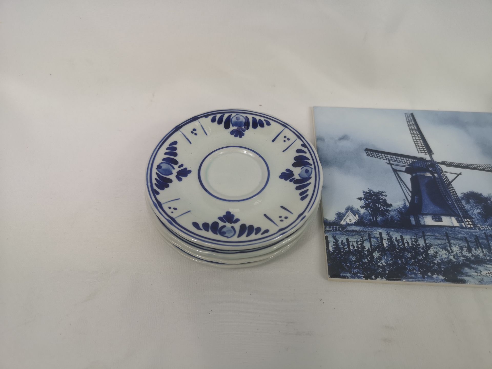 Four Delft cups and saucers together with a Delft tile - Image 3 of 4