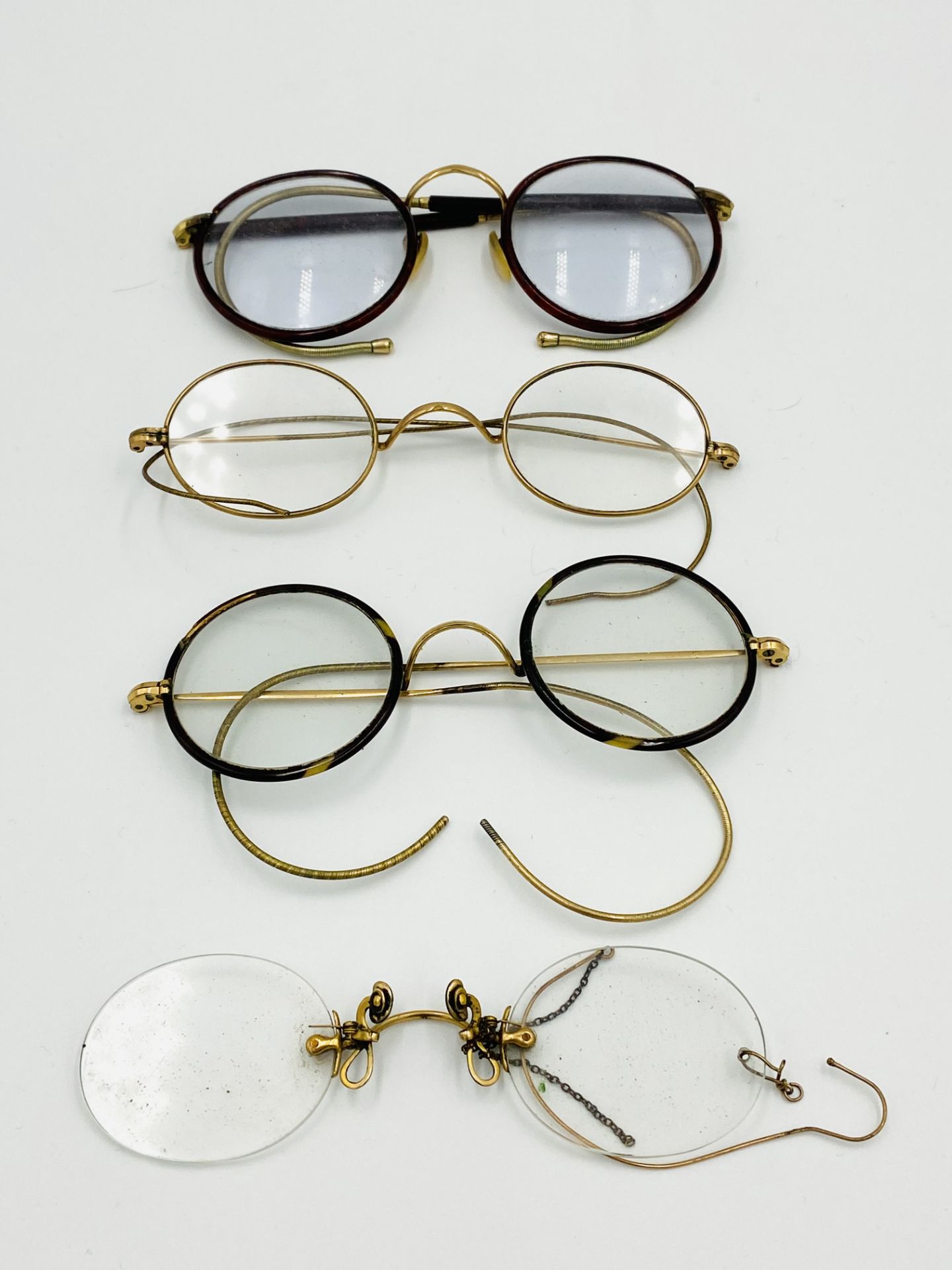 Three pairs of spectacles and a pair of prince nez