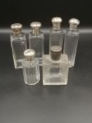 Dupont glass perfume bottle together with 5 silver topped dressing table bottles