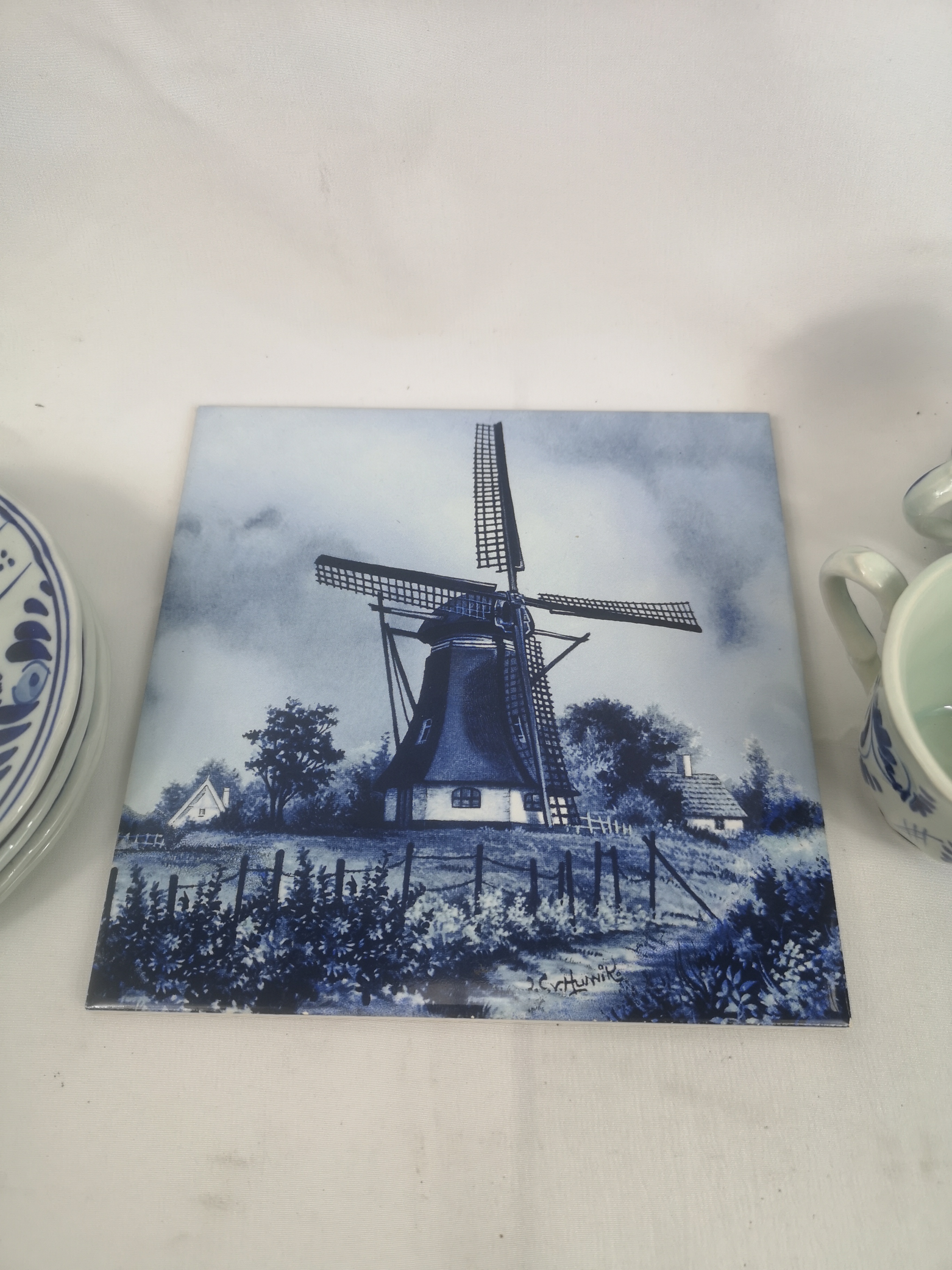Four Delft cups and saucers together with a Delft tile - Image 4 of 4