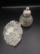 Cut glass perfume bottle together with a white metal filigree tray