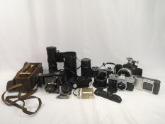 Canon FTB camera body together with various lenses and equipment
