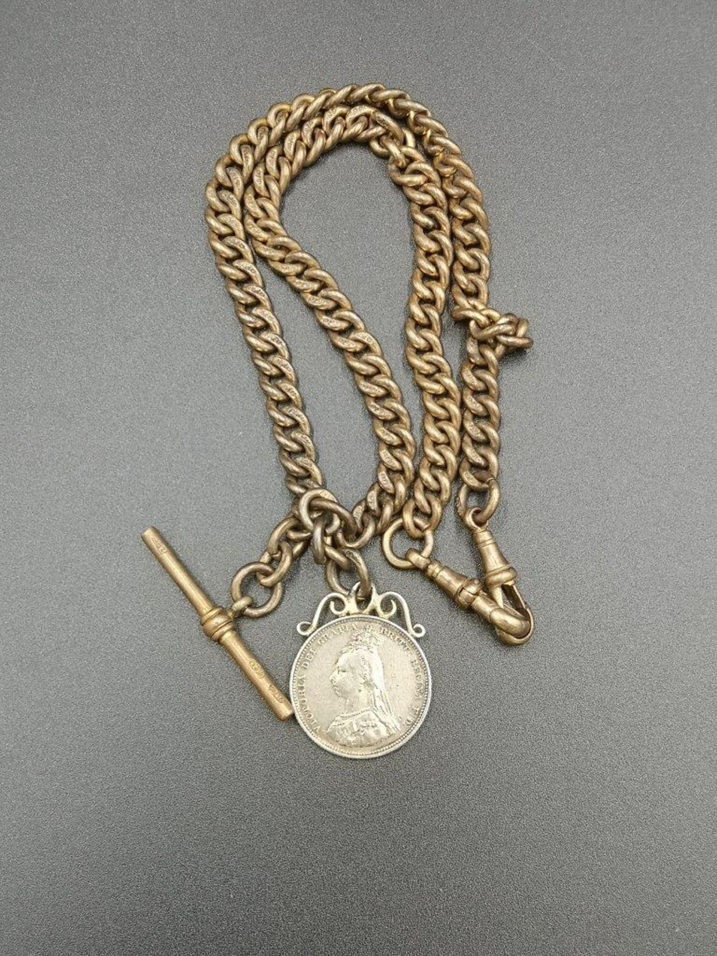 18ct gold fob chain with mounted silver sixpence 1887