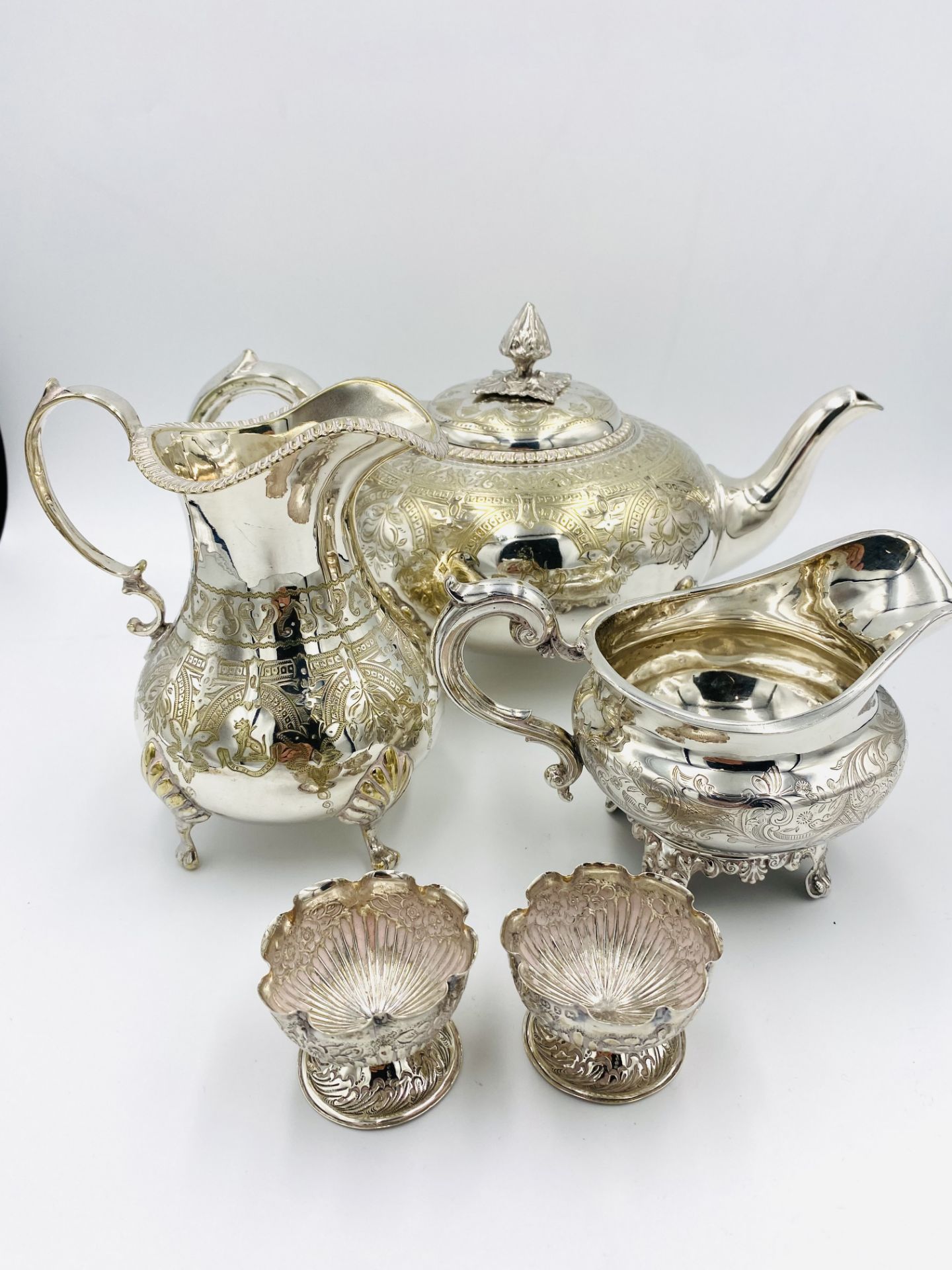 Victorian silver milk jug, pair of silver egg cups and a silver plate teapot