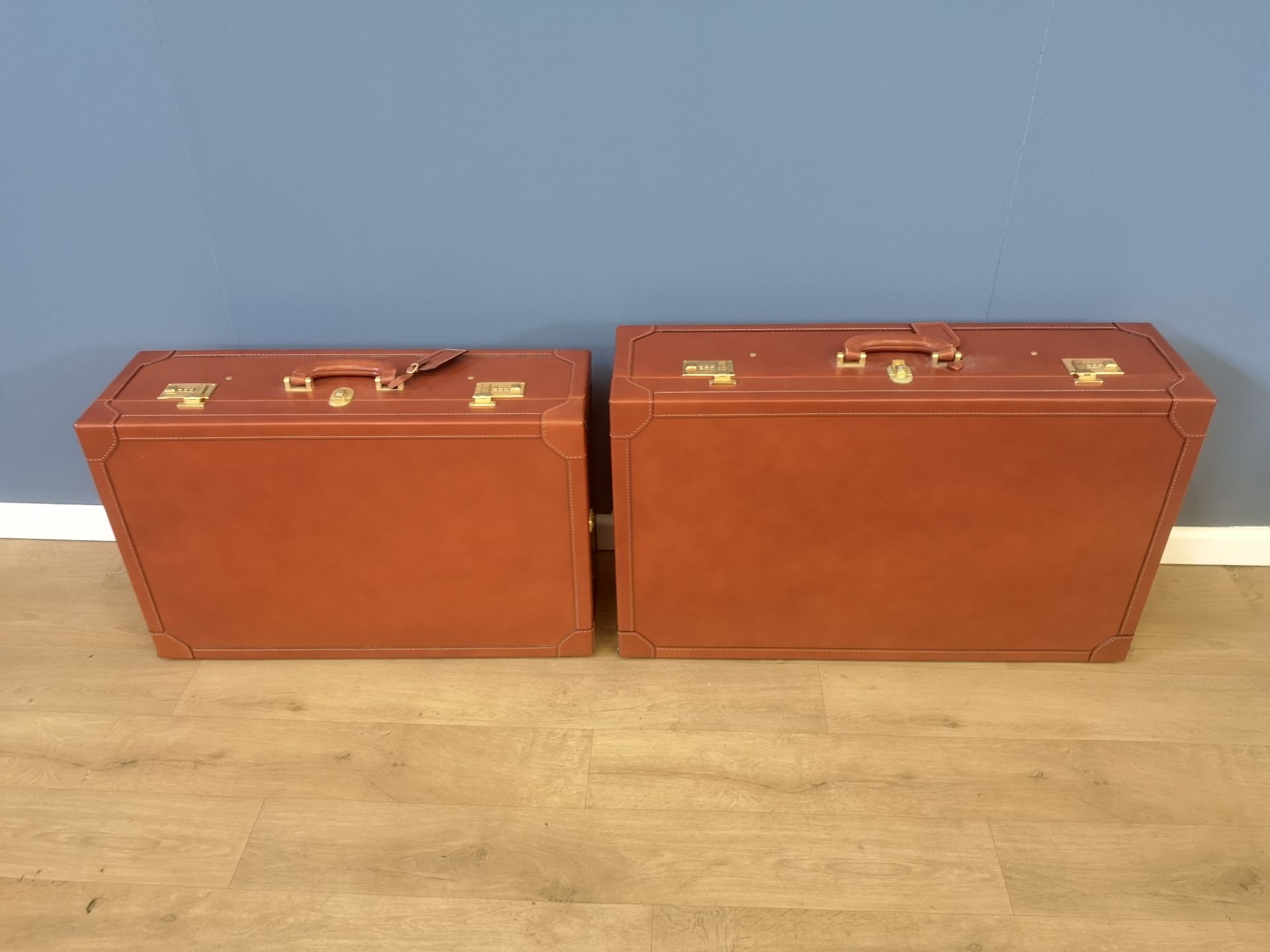 Two Asprey hard sided leather suitcases