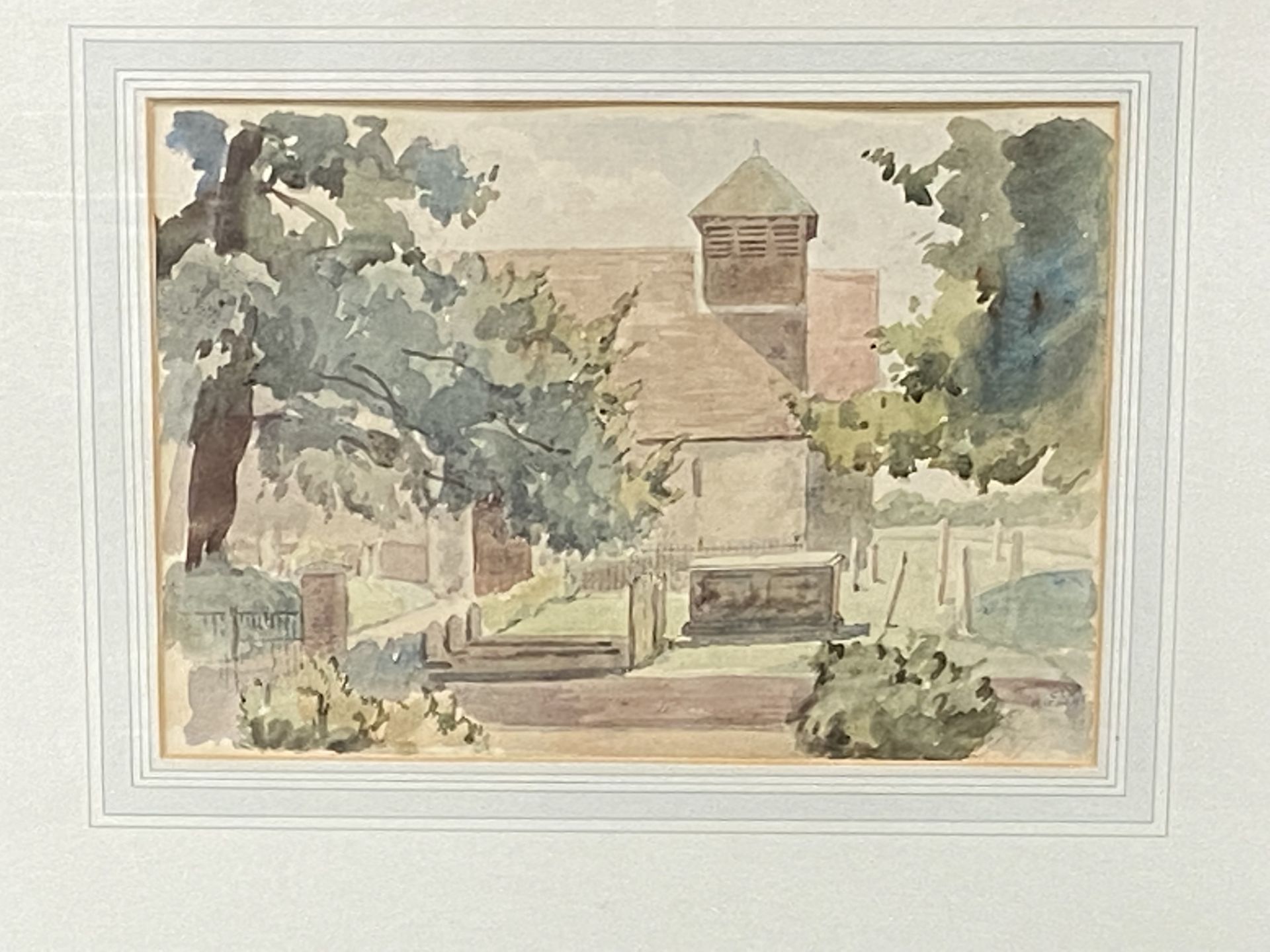 Framed and glazed watercolour of a churchyard