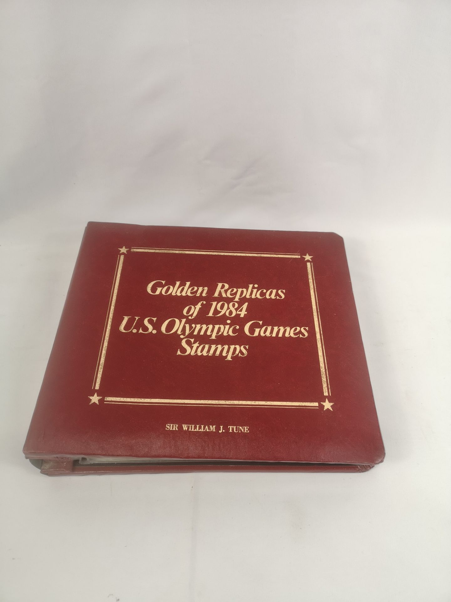 An album containing 'Golden Replicas of 1984 U.S. Olympic Games Stamps.