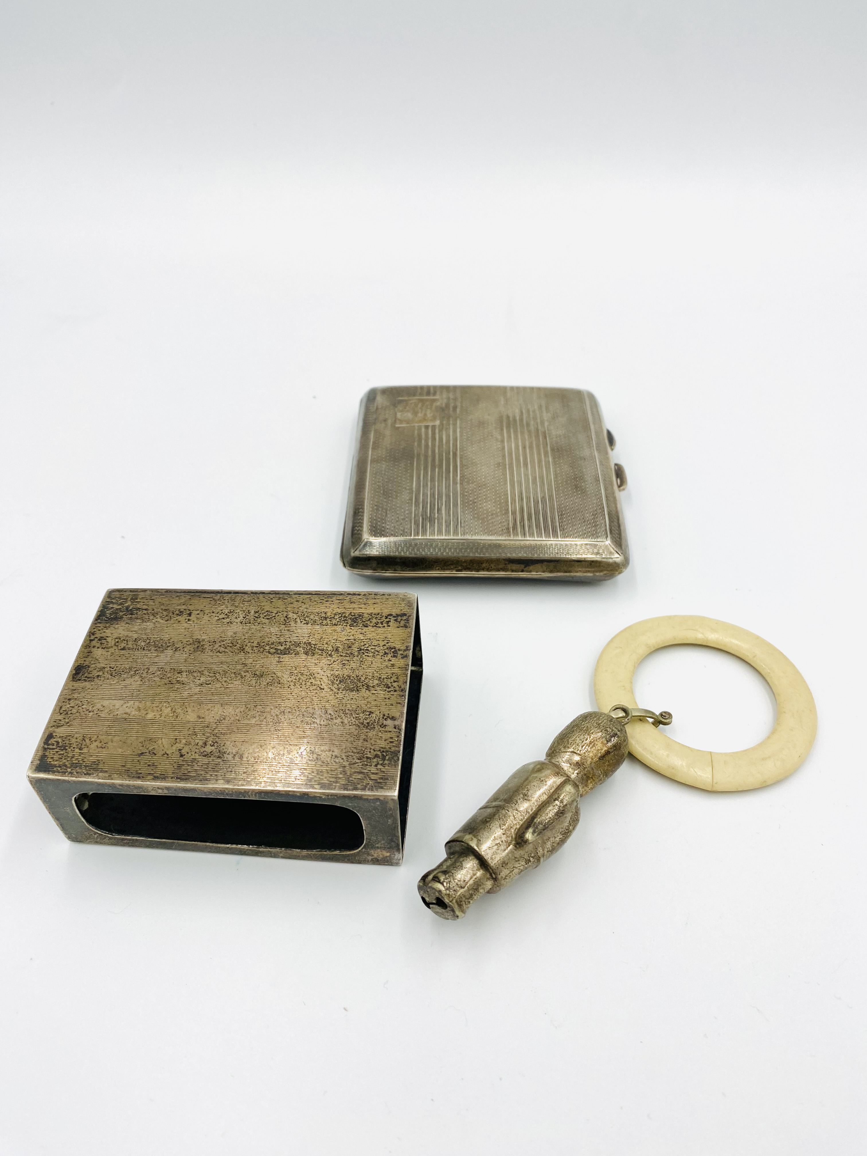 Silver cigarette case and matchbox holder together with an EPNS teething ring